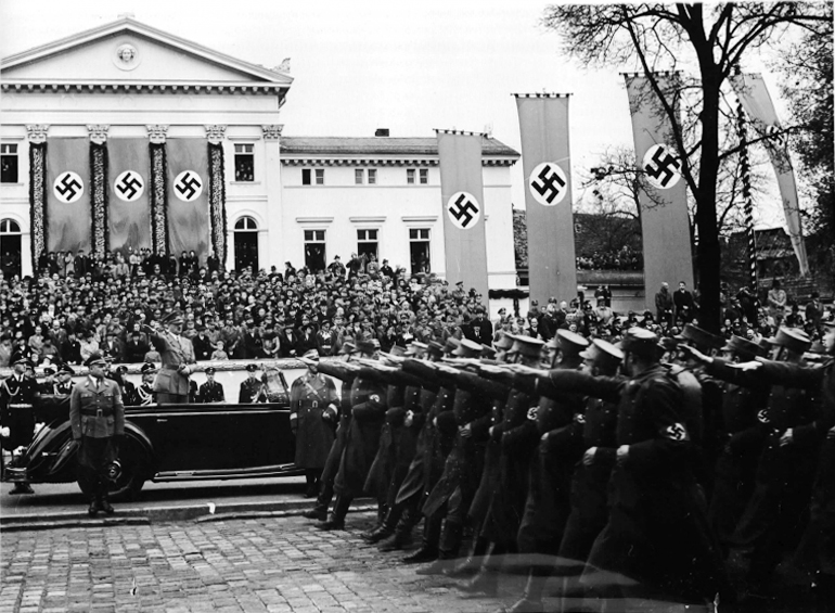 Adolf Hitler salutes the parade for the Gauparteitag in Weimar